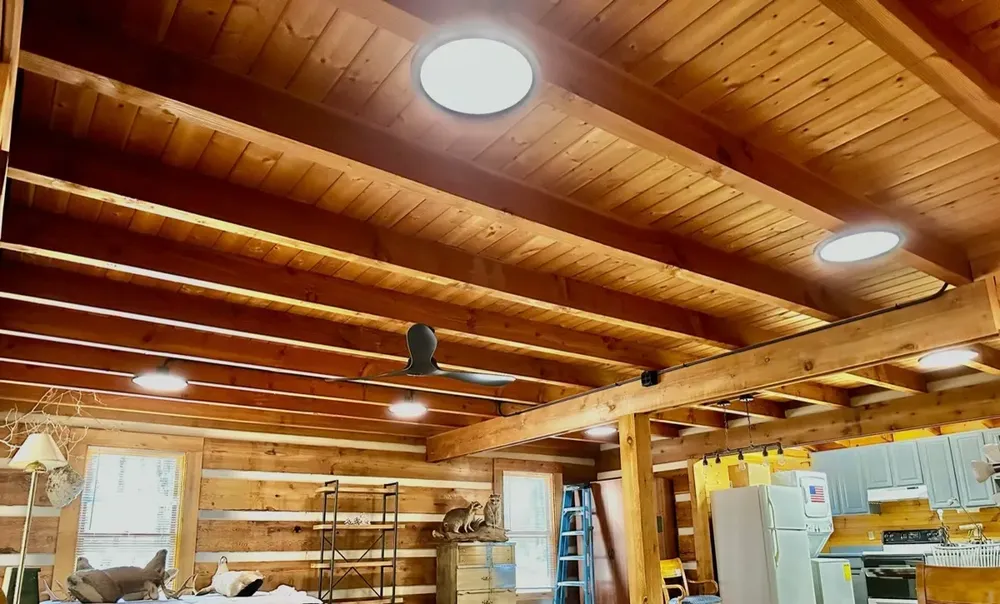 Residential cabin light fixtures and ceiling fan install - Work completed by Mills Electric Co.