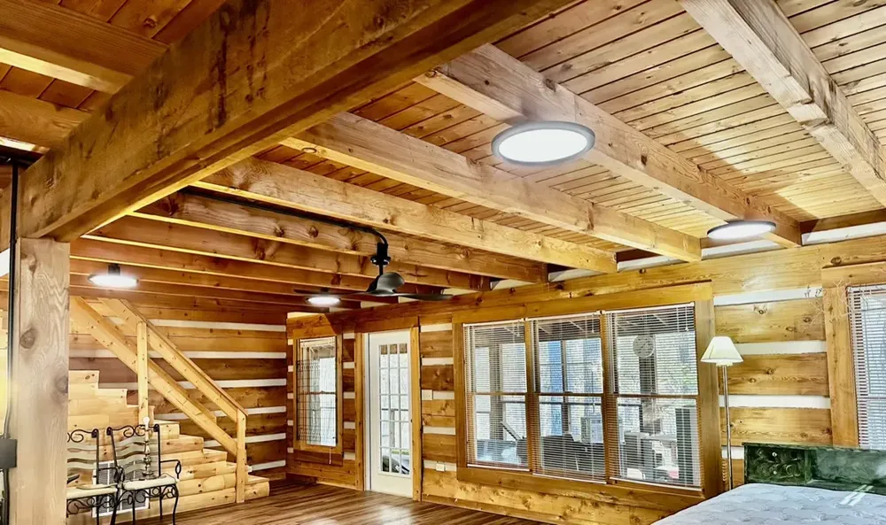 Residential cabin light fixtures and ceiling fan install - Work completed by Mills Electric Co.