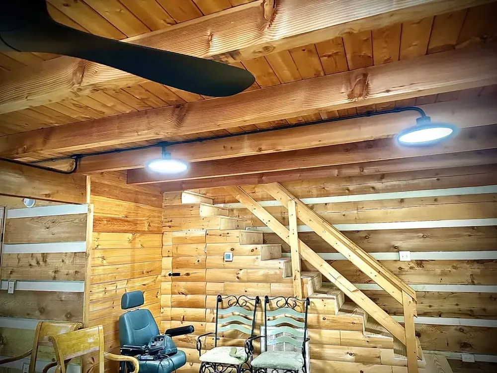 Residential cabin light fixtures and ceiling fan install - Work completed by Mills Electric Co.
