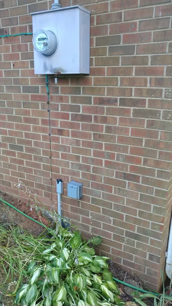 Whole-home standby generator plug and transfer switch wiring install - Work completed by Mills Electric Co.