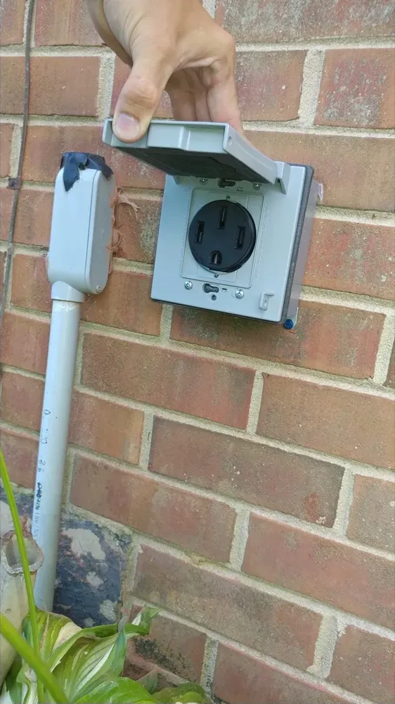 Whole-home standby generator plug and transfer switch wiring install - Work completed by Mills Electric Co.