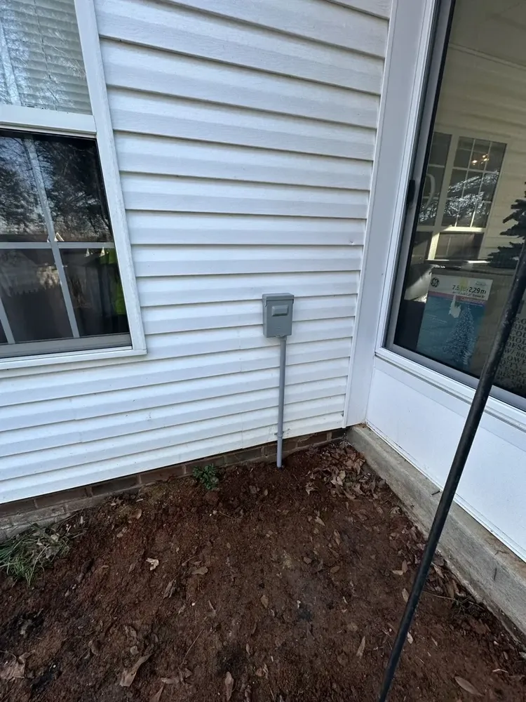 Ductless mini-split outdoor heat pump electrical hookups and isolator switch - Work completed by Mills Electric Co.