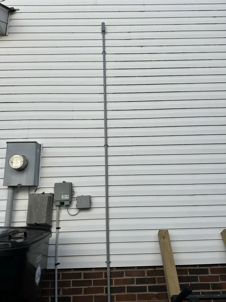 Ductless mini-split outdoor heat pump electrical hookups and isolator switch - Work completed by Mills Electric Co.
