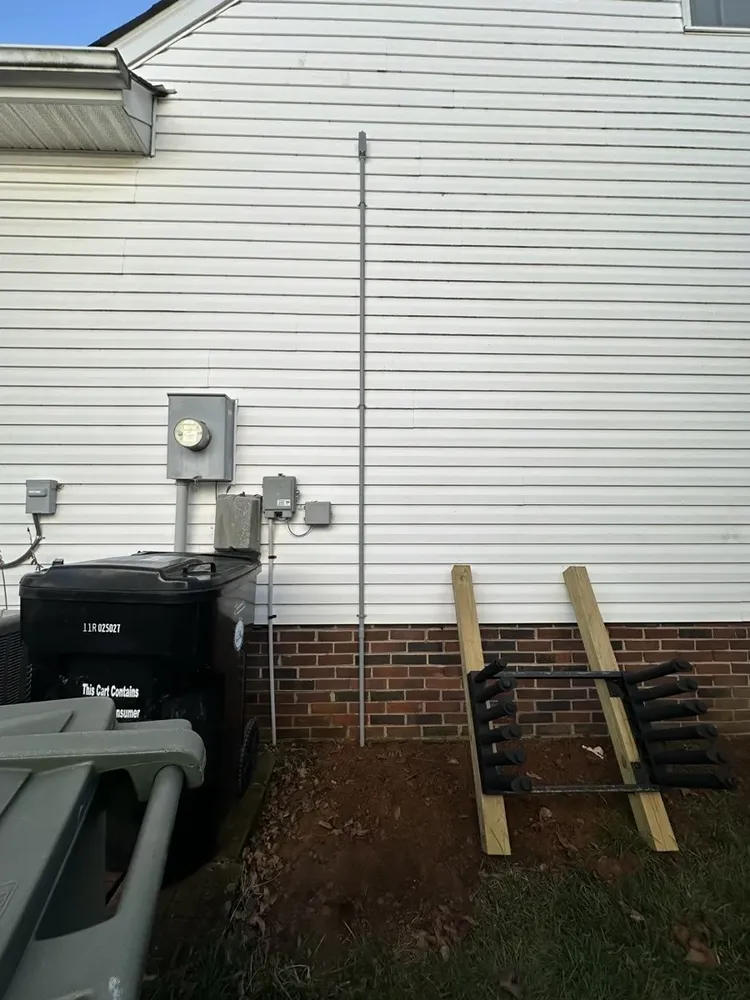 Ductless mini-split outdoor heat pump electrical hookups and isolator switch - Work completed by Mills Electric Co.