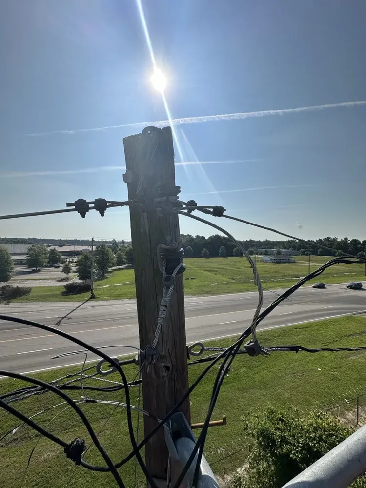 Commercial exterior parking lot lighting and structural poles repair - Work completed by Mills Electric Co.