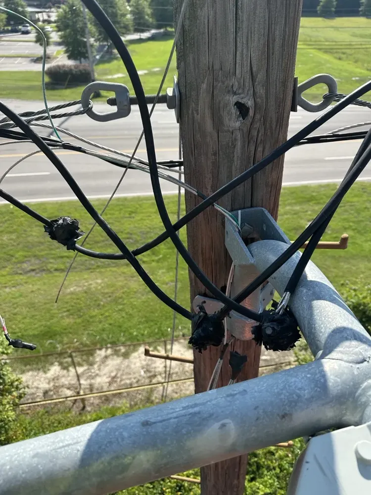 Commercial exterior parking lot lighting and structural poles repair - Work completed by Mills Electric Co.