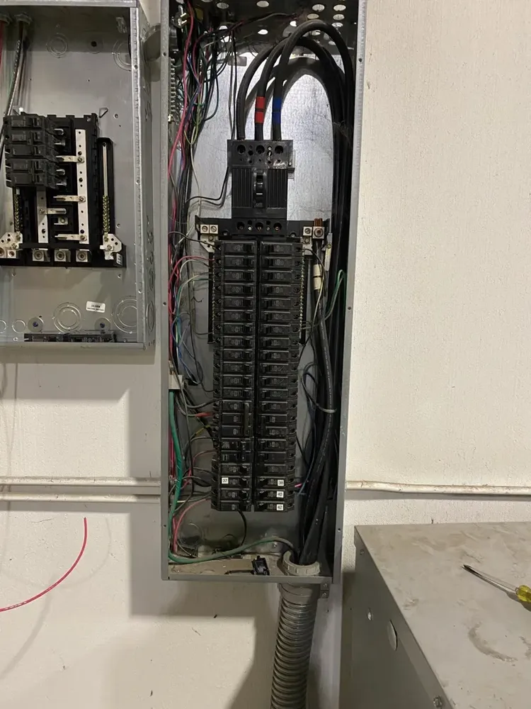 Warehouse subpanel expansion to feed large UPS battery power backups - Work completed by Mills Electric Co.