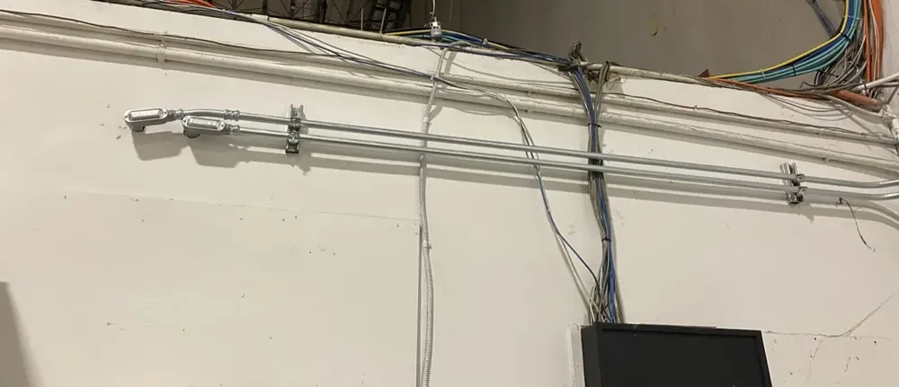 Warehouse subpanel expansion to feed large UPS battery power backups - Work completed by Mills Electric Co.