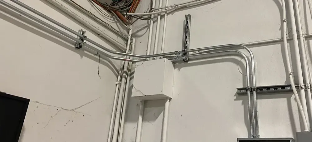 Warehouse subpanel expansion to feed large UPS battery power backups - Work completed by Mills Electric Co.