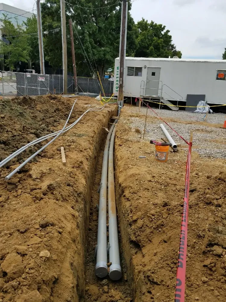 Commercial electrical underground trenches, feeders, and utility transformer connections - Work completed by Mills Electric Co.