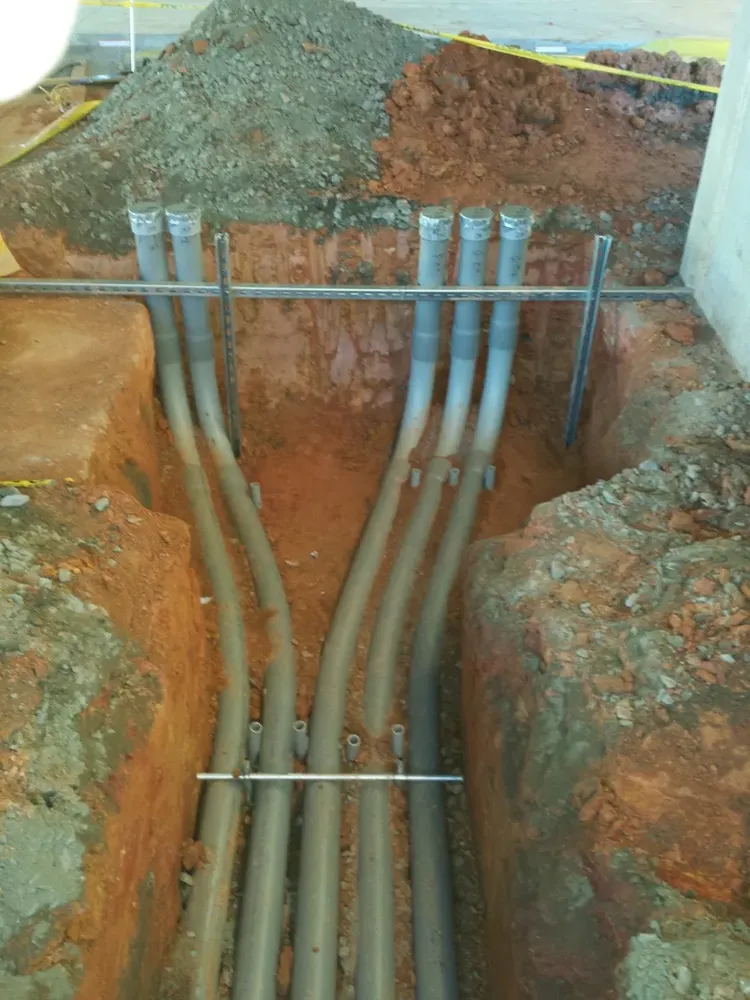 Commercial electrical underground trenches, feeders, and utility transformer connections - Work completed by Mills Electric Co.