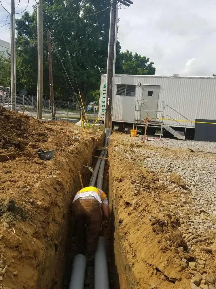 Commercial electrical underground trenches, feeders, and utility transformer connections - Work completed by Mills Electric Co.