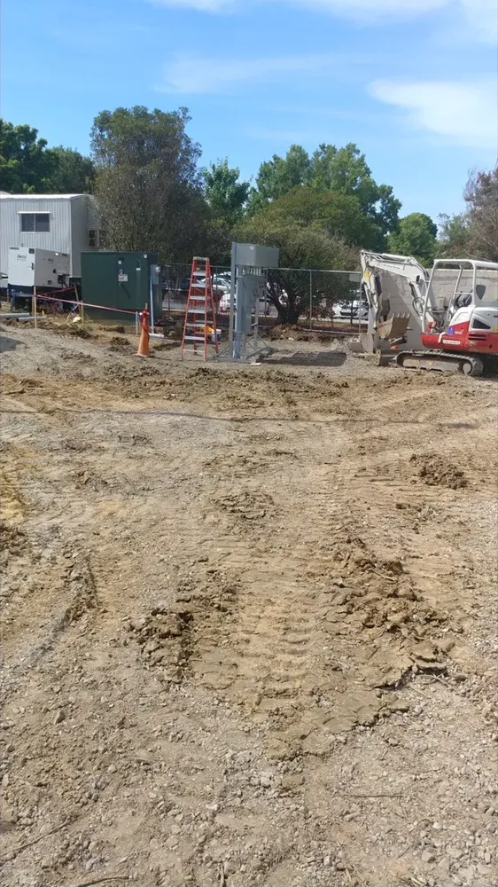 Commercial electrical underground trenches, feeders, and utility transformer connections - Work completed by Mills Electric Co.