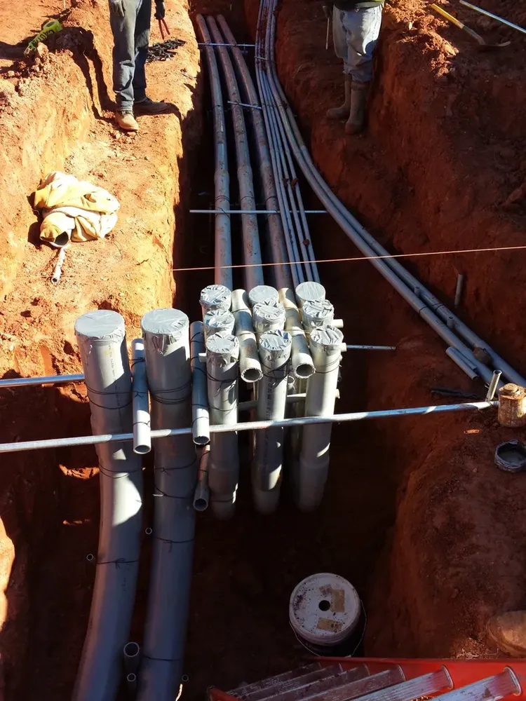 Commercial electrical underground trenches, feeders, and utility transformer connections - Work completed by Mills Electric Co.