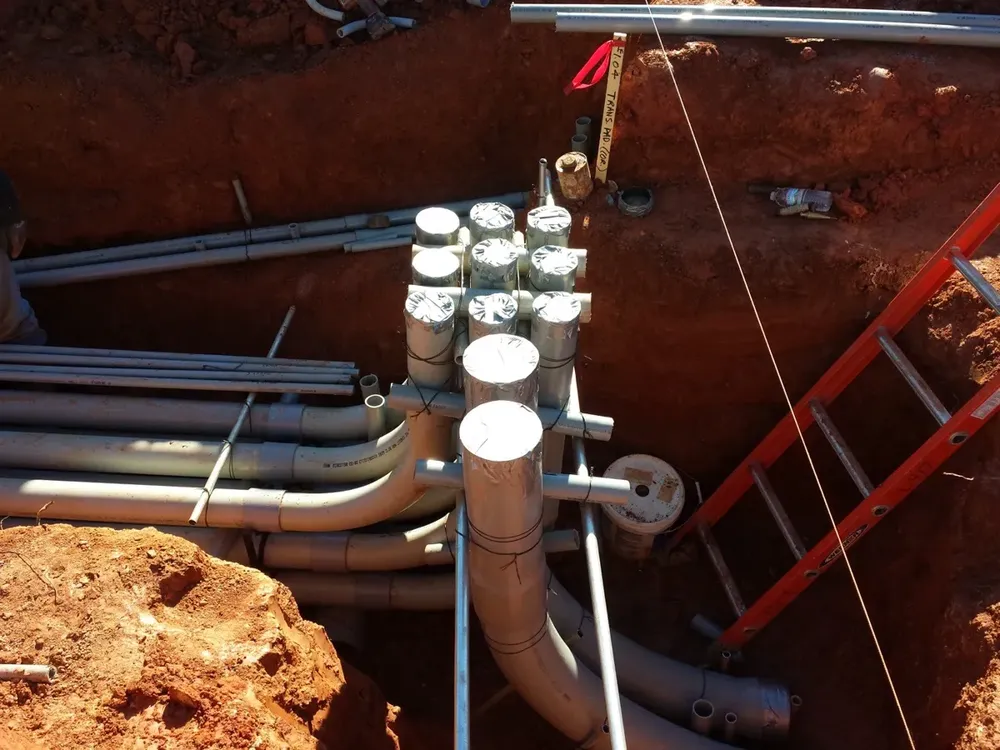 Commercial electrical underground trenches, feeders, and utility transformer connections - Work completed by Mills Electric Co.