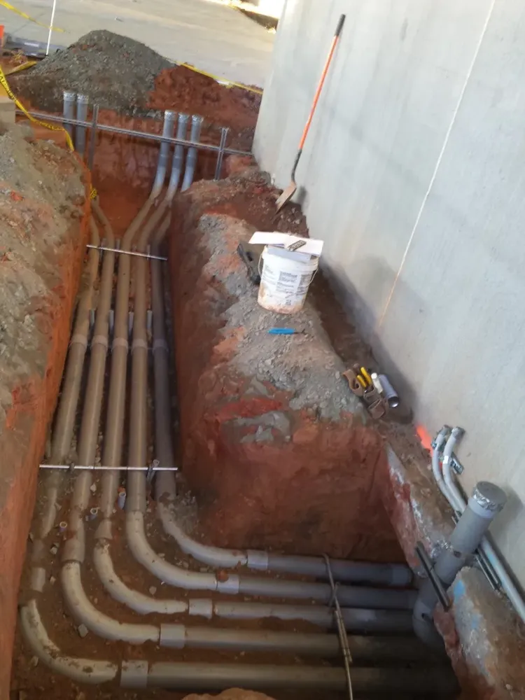 Commercial electrical underground trenches, feeders, and utility transformer connections - Work completed by Mills Electric Co.