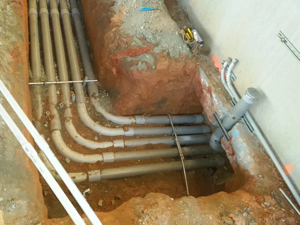 Commercial electrical underground trenches, feeders, and utility transformer connections - Work completed by Mills Electric Co.
