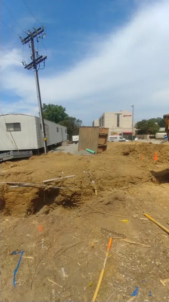Commercial electrical underground trenches, feeders, and utility transformer connections - Work completed by Mills Electric Co.